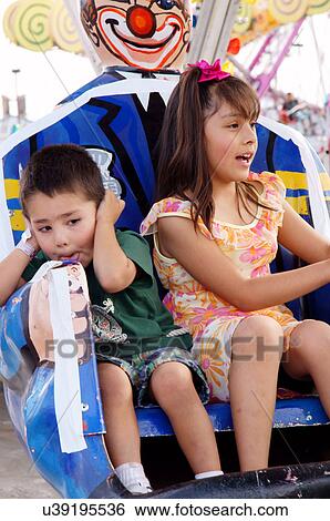 girl and boy on carnival ride children kids kid View Large Photo Image Stock Photograph - girl and boy on carnival ride children kids kid. Fotosearch