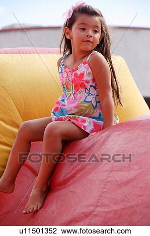 Stock Image -  girl child kid inflatable bounce house sport. Fotosearch