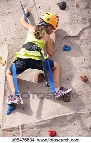 girl child kid rock climbing indoor sport kids View Large Photo Image Picture - girl child kid rock climbing indoor sport kids. Fotosearch