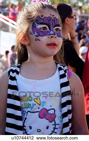Stock Image -  girl child kid with face painting purple hello. Fotosearch