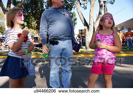 Stock Photograph -  grandpa takes to the fair face painting treats. Fotosearch