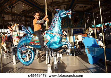 hspanic boy child kid male on carousel horse View Large Photo Image Stock Image - hspanic boy child kid male on carousel horse. Fotosearch