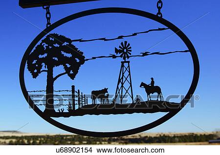Picture -  ironwork ranch scene cowboy cattle iron metal. Fotosearch