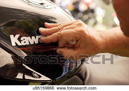 Stock Photograph -  kawasaki cycle detailing closeup detail paint. Fotosearch