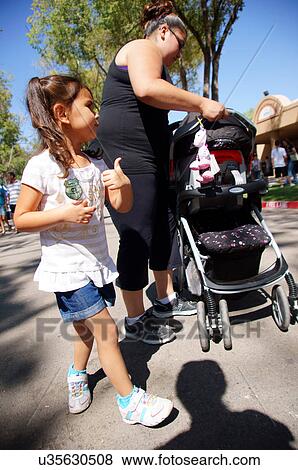 latino hispanic family on street girl gesturing View Large Photo Image Stock Photo - latino hispanic family on street girl gesturing. Fotosearch