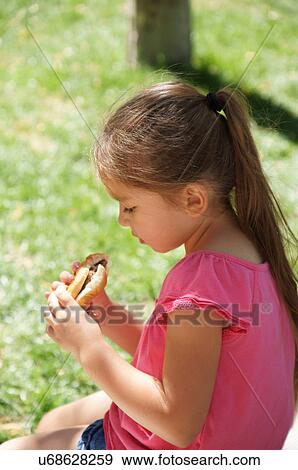latino hispanic girl child kid eating hamburger View Large Photo Image Stock Photo - latino hispanic girl child kid eating hamburger. Fotosearch
