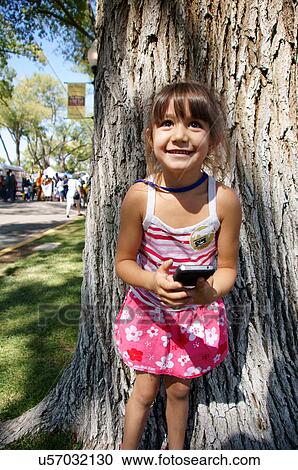 little girl child kid with cell phone iphone View Large Photo Image Stock Image - little girl child kid with cell phone iphone. Fotosearch