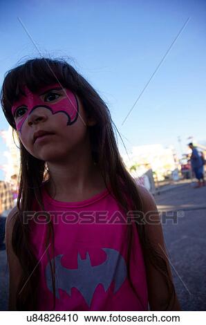 Stock Image -  lonely girl with face painting batwoman bat. Fotosearch