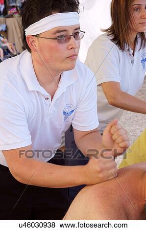 Stock Photo -  male massage asian medical people hand man on. Fotosearch