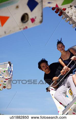 man male and woman female on amusement park ride View Large Photo Image Stock Image - man male and woman female on amusement park ride. Fotosearch