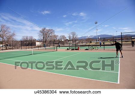 Picture -  man male playing tennis senior citizen aged alto. Fotosearch
