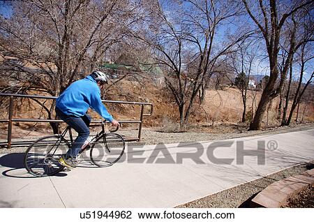 man male riding bike bicycle alto walking park View Large Photo Image Stock Image - man male riding bike bicycle alto walking park. Fotosearch