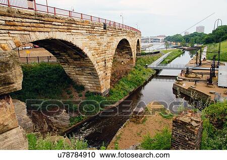 mill ruins park stone arch bridge minnesota mn View Large Photo Image Stock Image - mill ruins park stone arch bridge minnesota mn. Fotosearch