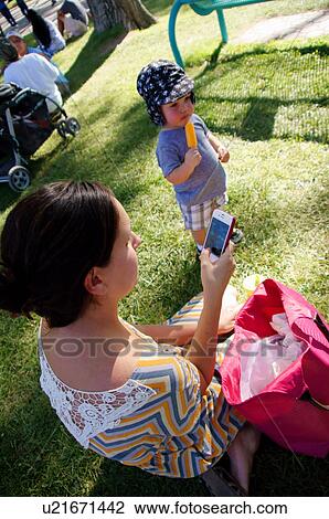 mother takes picture of baby son and admires on View Large Photo Image Stock Image - mother takes picture of baby son and admires on. Fotosearch