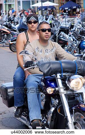 Stock Photograph -  motorcycle biker woman female people couple man. Fotosearch
