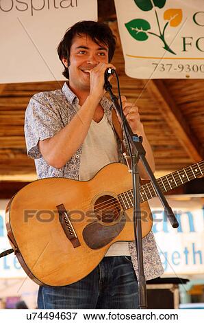 musician max gomez performing stage taos new nm View Large Photo Image Stock Photo - musician max gomez performing stage taos new nm. Fotosearch
