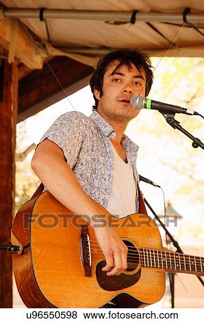 musician max gomez performing stage taos new nm View Large Photo Image Stock Photo - musician max gomez performing stage taos new nm. Fotosearch