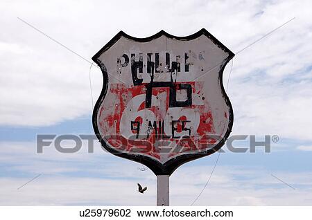 Stock Image -  old phillips 66 sign new mexico nm bird flying. Fotosearch