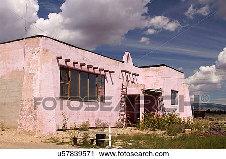 Stock Image -  old pink tres piedras new mexico nm highway 64. Fotosearch