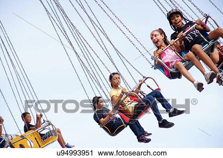 people on carnival ride chair wheel chain happy View Large Photo Image Stock Image - people on carnival ride chair wheel chain happy. Fotosearch