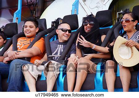 Stock Photography -  people on carnival ride laughing strapped in new. Fotosearch