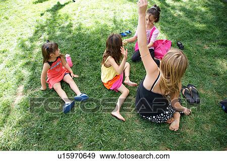 playing in grass children kids girls young View Large Photo Image Stock Photo - playing in grass children kids girls young. Fotosearch