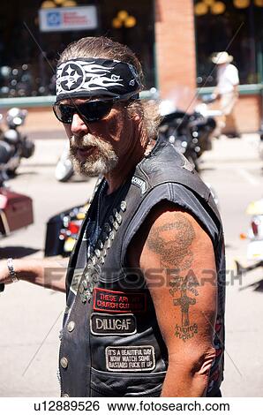 Stock Photograph -  portrait headshot gang member tatoos motorcycle. Fotosearch