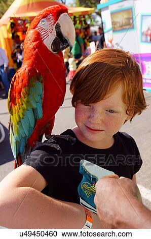 Stock Image -  redhead girl child kid with african amazon on. Fotosearch
