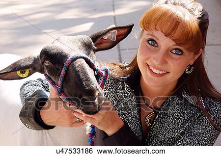 redhead woman female with goat portrait headshot View Large Photo Image Stock Photograph - redhead woman female with goat portrait headshot. Fotosearch