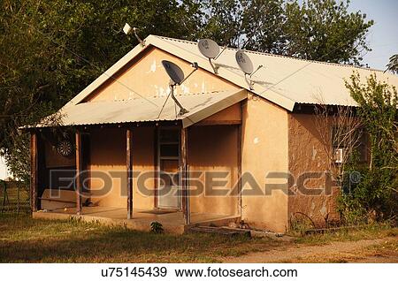 route 66 adobe house satellite dishes meade tx View Large Photo Image Stock Photo - route 66 adobe house satellite dishes meade tx. Fotosearch