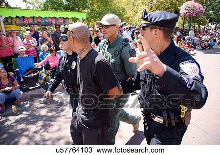 Stock Image -  santa fe nm cops arresting trouble maker hoodlum. Fotosearch