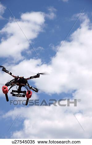 Stock Photography -  santa fe nm remote controlled helicopter flying. Fotosearch