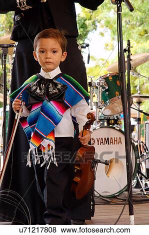 Stock Photo -  santa fe nm young boy play violinist mariachi de. Fotosearch
