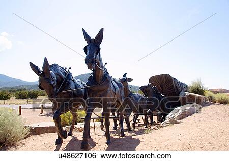 Stock Photograph -  sculpture of wagon train santa fe new mexico nm. Fotosearch