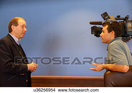 senator tom udall nm being tv reporter camera View Large Photo Image Picture - senator tom udall nm being tv reporter camera. Fotosearch