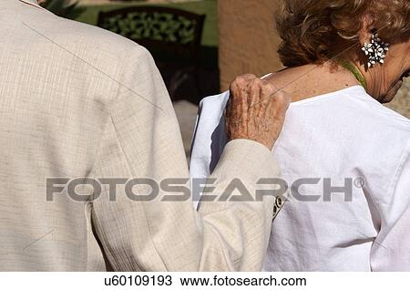 Stock Image -  senior citizen aged couple walk closeup hand old. Fotosearch