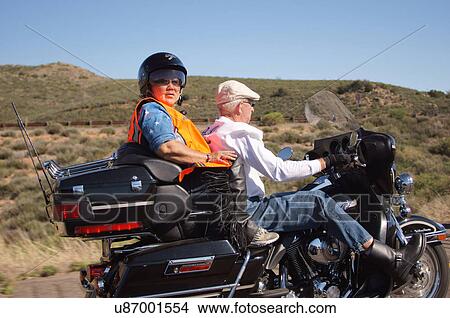 Picture -  senior citizen aged elderly biker harley motor. Fotosearch