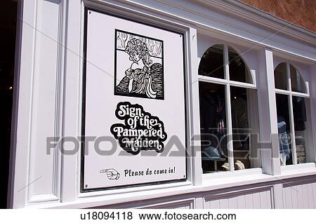 Stock Photo -  sign of the pampered maiden clothing store santa. Fotosearch