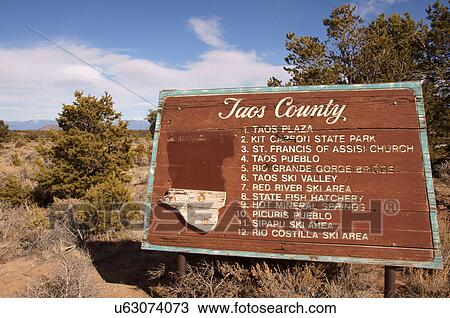 Stock Image -  taos county sign new mexico nm plaza kit carson. Fotosearch