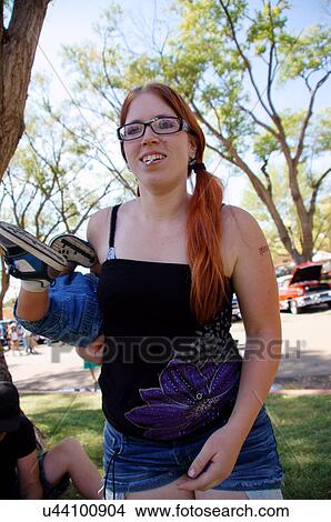 teen teenager girl holding twirling spinning boy View Large Photo Image Picture - teen teenager girl holding twirling spinning boy. Fotosearch