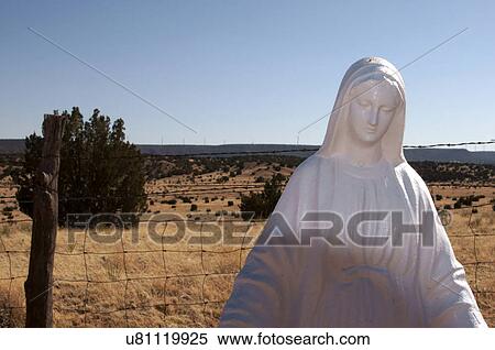 Stock Photography -  virgin de quadalupe holy mother statue cemetary. Fotosearch