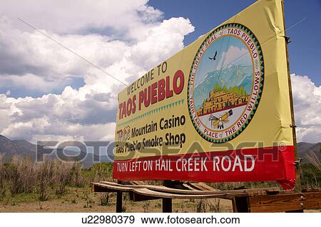 Stock Photo -  welcome to taos pueble sign cloud mass of water. Fotosearch