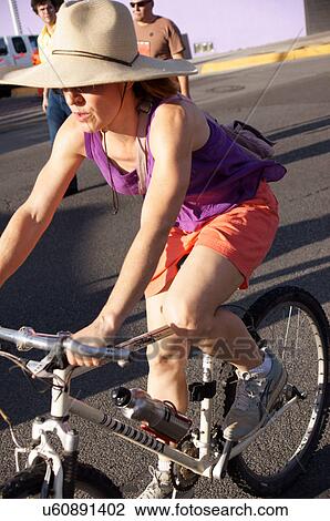woman female lady on bike bicycle agility being View Large Photo Image Stock Image - woman female lady on bike bicycle agility being. Fotosearch