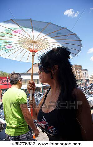 Stock Image -  woman female lady with umbrella street las vegas. Fotosearch