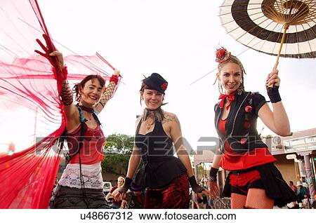 Stock Image -  women females girls stilts taos new mexico nm. Fotosearch