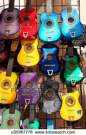 Stock Photograph -  wooden guitars on display ability adept aptitude. Fotosearch