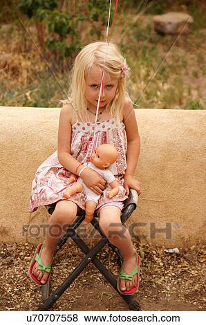 young girl doll child kid taos new mexico nm View Large Photo Image Stock Photo - young girl doll child kid taos new mexico nm. Fotosearch