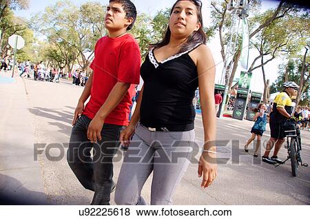 young latino hispanic couple walking man male View Large Photo Image Stock Photo - young latino hispanic couple walking man male. Fotosearch