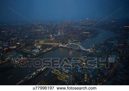 Stock Photo - Aerial cityscape of river Thames and Tower bridge at night, London, England, UK. Fotosearch