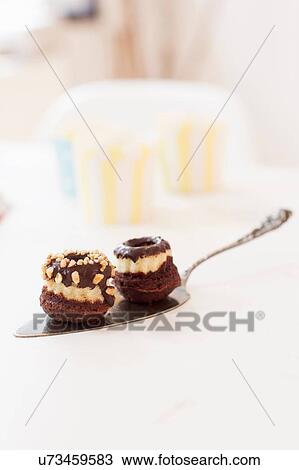 Chocolate covered baked product on cake server View Large Photo Image Stock Image - Chocolate covered baked product on cake server. Fotosearch